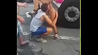 A Man Performs Oral Sex On A Woman In A Public Setting