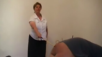 Mature Female Dominates Man With A Cane